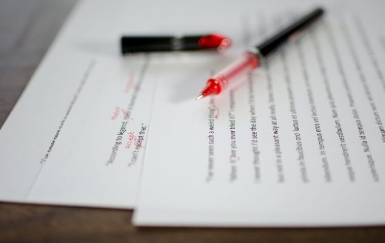 closeup of document with red pen